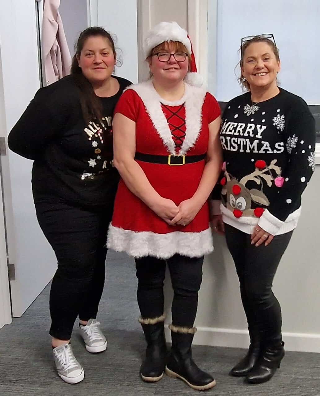 3 staff members dressed up for Christmas Jumper Day at Homecarers Cheshire