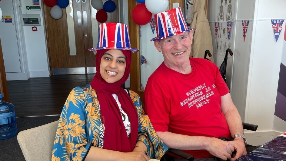 Image shows Hannan with service user Glenn at work