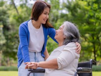 Mother receiving care from her caregiver daughter